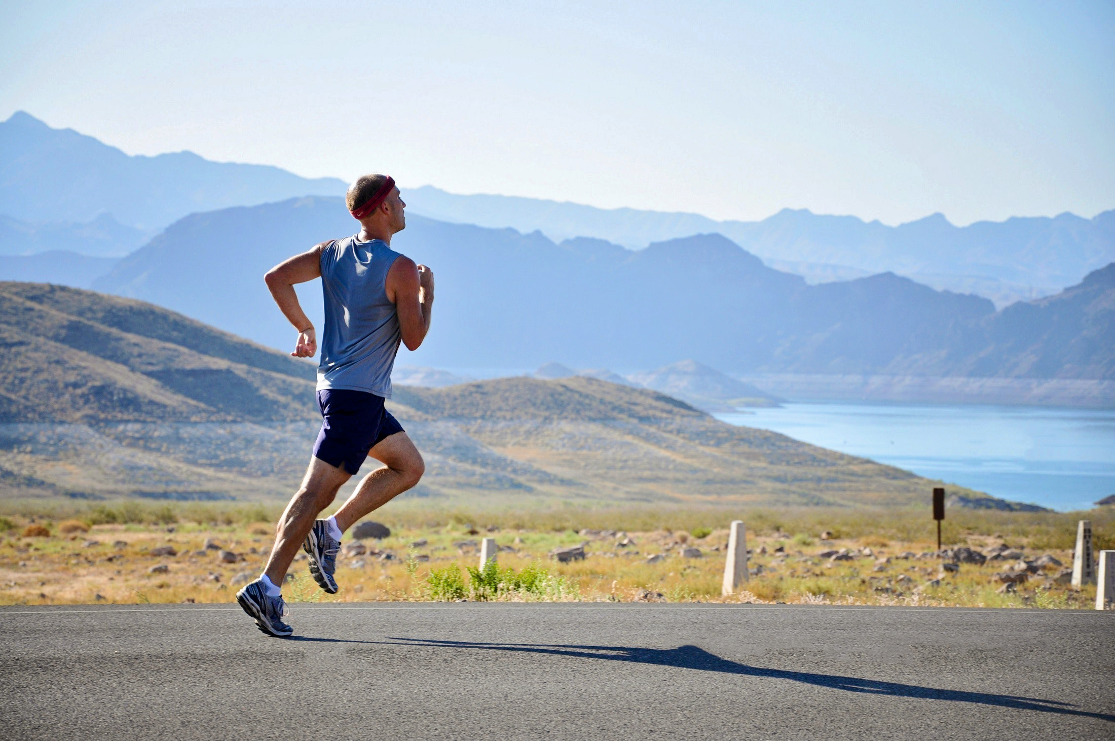 orig athletic man running in the country side
