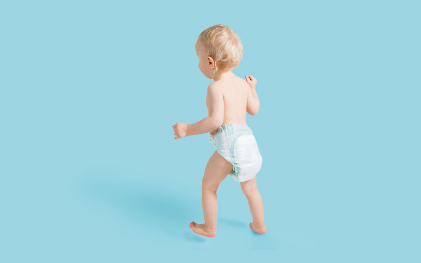 Baby walking with diapers