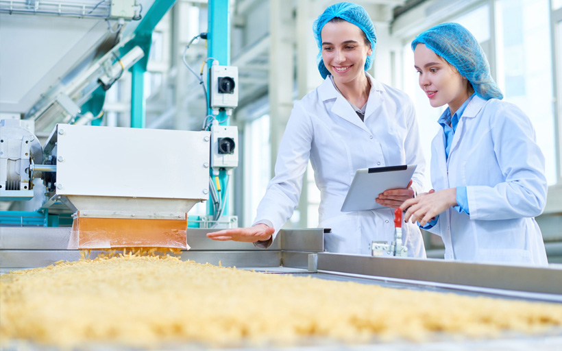 Two ladies in food processing factory