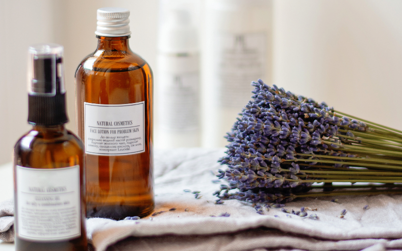 Natural oil in a bottle and lavender