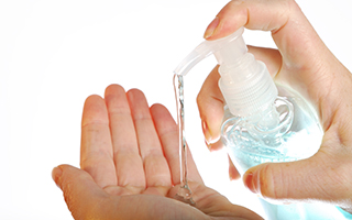 Hand Applying Hand Sanitizer