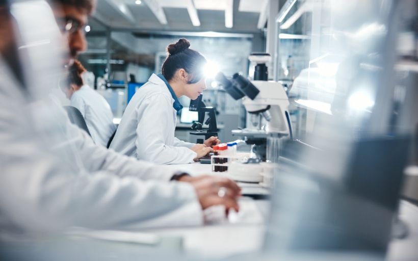 Research and Scientist in Laboratory with Microscope