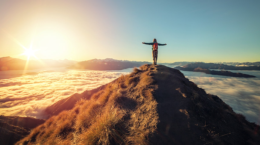 woman on top of mountains